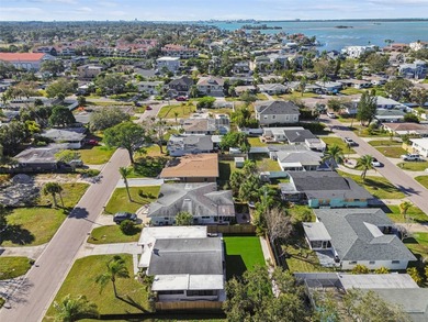 Welcome home to laid-back coastal living in the heart of Dunedin on The Dunedin Country Club in Florida - for sale on GolfHomes.com, golf home, golf lot