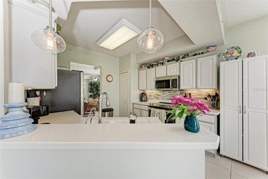 Impeccably maintained and beautifully styled with coastal decor on Sarasota National Golf Club in Florida - for sale on GolfHomes.com, golf home, golf lot