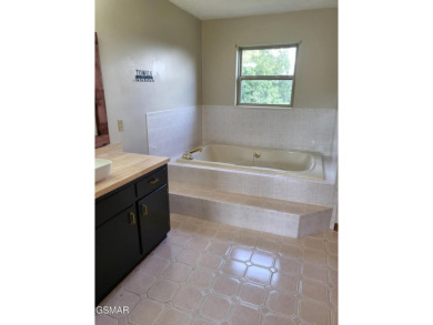 This home is immaculate! It can be used as a full time residence on Sevierville Golf Club in Tennessee - for sale on GolfHomes.com, golf home, golf lot
