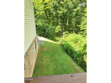 This home is immaculate! It can be used as a full time residence on Sevierville Golf Club in Tennessee - for sale on GolfHomes.com, golf home, golf lot