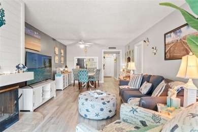 Under contract-accepting backup offers. Welcome to resort-style on Feather Sound Country Club in Florida - for sale on GolfHomes.com, golf home, golf lot