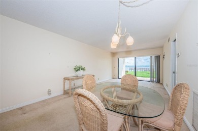 Tranquil views from this 2-bedroom 2-bathroom condo which is on Isla Del Sol Yacht and Country Club in Florida - for sale on GolfHomes.com, golf home, golf lot