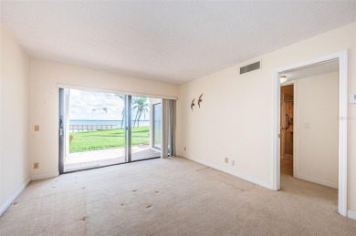 Tranquil views from this 2-bedroom 2-bathroom condo which is on Isla Del Sol Yacht and Country Club in Florida - for sale on GolfHomes.com, golf home, golf lot