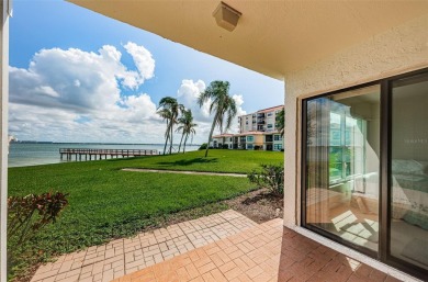 Tranquil views from this 2-bedroom 2-bathroom condo which is on Isla Del Sol Yacht and Country Club in Florida - for sale on GolfHomes.com, golf home, golf lot
