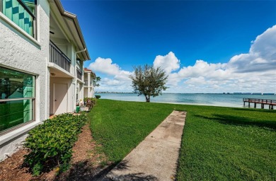 Tranquil views from this 2-bedroom 2-bathroom condo which is on Isla Del Sol Yacht and Country Club in Florida - for sale on GolfHomes.com, golf home, golf lot