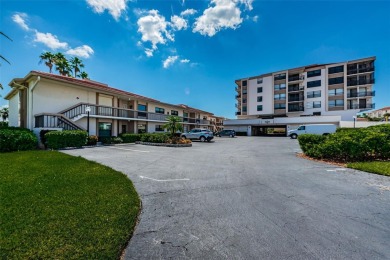 Tranquil views from this 2-bedroom 2-bathroom condo which is on Isla Del Sol Yacht and Country Club in Florida - for sale on GolfHomes.com, golf home, golf lot