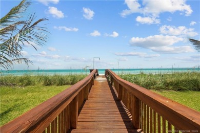 Step into a world of coastal luxury with this stunning 2BD, 2BA on Island Dunes Country Club in Florida - for sale on GolfHomes.com, golf home, golf lot