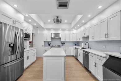 Step into a world of coastal luxury with this stunning 2BD, 2BA on Island Dunes Country Club in Florida - for sale on GolfHomes.com, golf home, golf lot