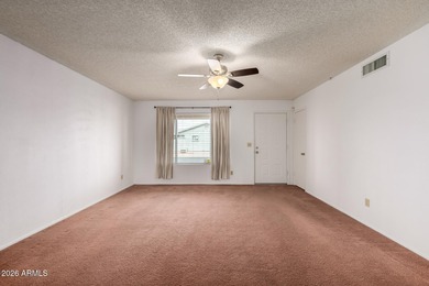 2 bedroom 1.75 bath home with an Arizona room perfect for on Fountain of the Sun Country Club in Arizona - for sale on GolfHomes.com, golf home, golf lot