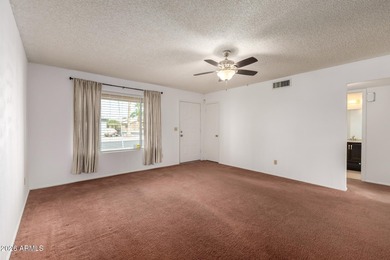 2 bedroom 1.75 bath home with an Arizona room perfect for on Fountain of the Sun Country Club in Arizona - for sale on GolfHomes.com, golf home, golf lot