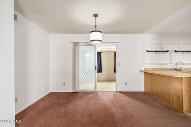 2 bedroom 1.75 bath home with an Arizona room perfect for on Fountain of the Sun Country Club in Arizona - for sale on GolfHomes.com, golf home, golf lot