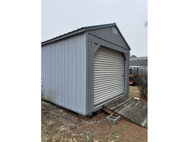 Cleared lot with camper with addition.  Lot is fully stoned...NO on Captains Cove Golf and Yacht Club in Virginia - for sale on GolfHomes.com, golf home, golf lot