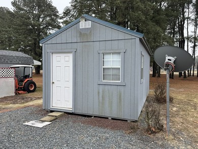 Cleared lot with camper with addition.  Lot is fully stoned...NO on Captains Cove Golf and Yacht Club in Virginia - for sale on GolfHomes.com, golf home, golf lot