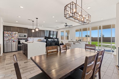 The Carlyle's inviting covered porch and entry flow into the on Sterling Grove Golf & Country Club in Arizona - for sale on GolfHomes.com, golf home, golf lot