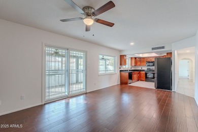 This charming Dobson Ranch home is freshly painted throughout on Dobson Ranch Municipal Golf Course in Arizona - for sale on GolfHomes.com, golf home, golf lot