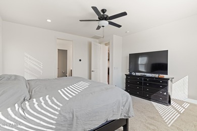 The Carlyle's inviting covered porch and entry flow into the on Sterling Grove Golf & Country Club in Arizona - for sale on GolfHomes.com, golf home, golf lot