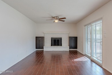 This charming Dobson Ranch home is freshly painted throughout on Dobson Ranch Municipal Golf Course in Arizona - for sale on GolfHomes.com, golf home, golf lot