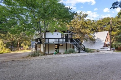 Discover your dream getaway at this idyllic lakehouse nestled in on Tanglewood Resort in Texas - for sale on GolfHomes.com, golf home, golf lot