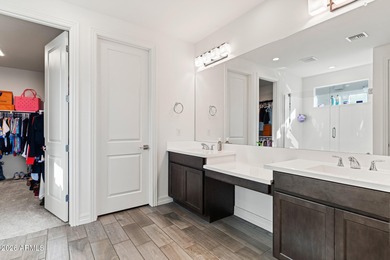 The Carlyle's inviting covered porch and entry flow into the on Sterling Grove Golf & Country Club in Arizona - for sale on GolfHomes.com, golf home, golf lot