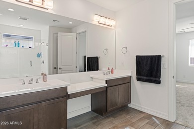 The Carlyle's inviting covered porch and entry flow into the on Sterling Grove Golf & Country Club in Arizona - for sale on GolfHomes.com, golf home, golf lot