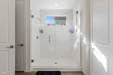 The Carlyle's inviting covered porch and entry flow into the on Sterling Grove Golf & Country Club in Arizona - for sale on GolfHomes.com, golf home, golf lot