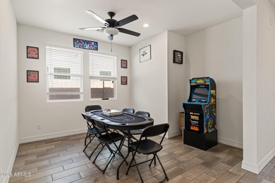 The Carlyle's inviting covered porch and entry flow into the on Sterling Grove Golf & Country Club in Arizona - for sale on GolfHomes.com, golf home, golf lot