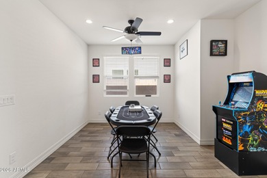 The Carlyle's inviting covered porch and entry flow into the on Sterling Grove Golf & Country Club in Arizona - for sale on GolfHomes.com, golf home, golf lot