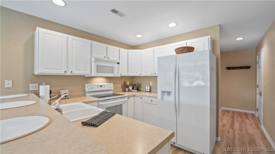 WOW!! BRAND NEW Living Area LVP and furnishings invite you into on Lake Valley Country Club in Missouri - for sale on GolfHomes.com, golf home, golf lot