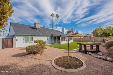 This charming Dobson Ranch home is freshly painted throughout on Dobson Ranch Municipal Golf Course in Arizona - for sale on GolfHomes.com, golf home, golf lot