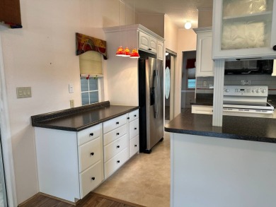 Located in an exclusive gated community with a championship on The Great Outdoors Golf and Country Club in Florida - for sale on GolfHomes.com, golf home, golf lot