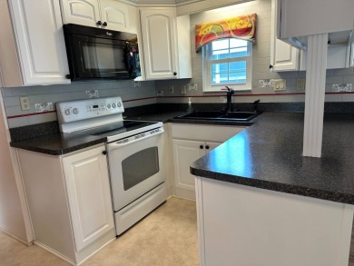 Located in an exclusive gated community with a championship on The Great Outdoors Golf and Country Club in Florida - for sale on GolfHomes.com, golf home, golf lot