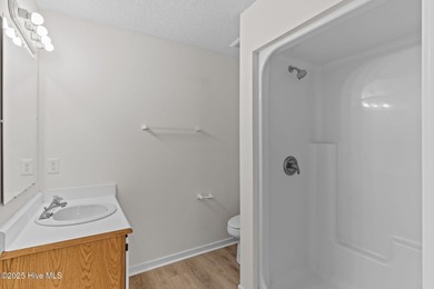 Welcome home 6128 Inland Greens Drive in nestled in the amenity on Inland Greens Golf Course in North Carolina - for sale on GolfHomes.com, golf home, golf lot