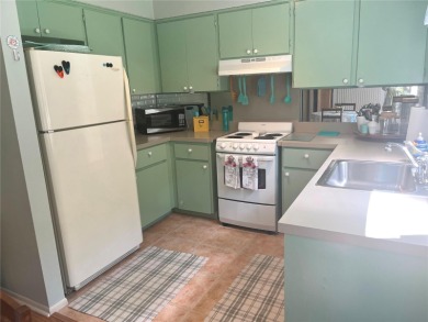 First Floor CONDO- 1BR/1.5 baths located with a view of the on Heather Golf and Country Club in Florida - for sale on GolfHomes.com, golf home, golf lot