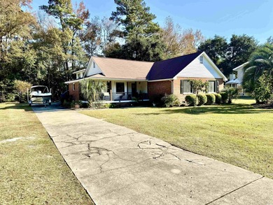 Looking for a gorgeous family home in a highly desirable on Wedgefield Plantation Golf Club in South Carolina - for sale on GolfHomes.com, golf home, golf lot