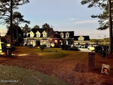 Enjoy lake front living in this luxury home in beautiful on Deercroft Golf and Country Club in North Carolina - for sale on GolfHomes.com, golf home, golf lot