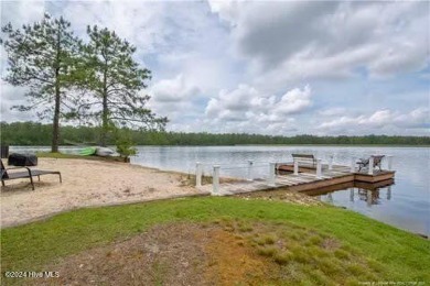 Enjoy lake front living in this luxury home in beautiful on Deercroft Golf and Country Club in North Carolina - for sale on GolfHomes.com, golf home, golf lot