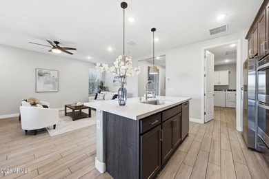 Situated on Hole 14, this beautifully upgraded home showcases on Verrado Golf Club - Victory in Arizona - for sale on GolfHomes.com, golf home, golf lot