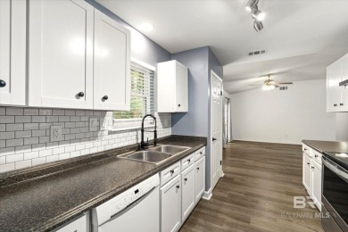 This remodeled 3-bedroom, 2-bath brick home is centrally located on Lake Forest Yacht and Country Club in Alabama - for sale on GolfHomes.com, golf home, golf lot