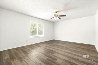 This remodeled 3-bedroom, 2-bath brick home is centrally located on Lake Forest Yacht and Country Club in Alabama - for sale on GolfHomes.com, golf home, golf lot