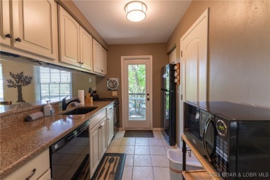 The 2 bed/2bath home with lake view is just what you are looking on The Oaks Golf Course in Missouri - for sale on GolfHomes.com, golf home, golf lot