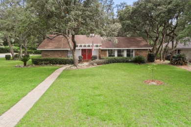 Nestled on a spacious 1/3-acre corner lot backing to a peaceful on Golf Club at Bluewater Bay Resort in Florida - for sale on GolfHomes.com, golf home, golf lot