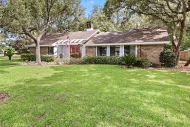 Nestled on a spacious 1/3-acre corner lot backing to a peaceful on Golf Club at Bluewater Bay Resort in Florida - for sale on GolfHomes.com, golf home, golf lot