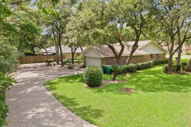 Nestled on a spacious 1/3-acre corner lot backing to a peaceful on Golf Club at Bluewater Bay Resort in Florida - for sale on GolfHomes.com, golf home, golf lot
