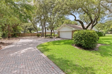 Nestled on a spacious 1/3-acre corner lot backing to a peaceful on Golf Club at Bluewater Bay Resort in Florida - for sale on GolfHomes.com, golf home, golf lot