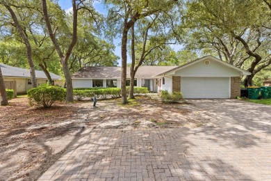Nestled on a spacious 1/3-acre corner lot backing to a peaceful on Golf Club at Bluewater Bay Resort in Florida - for sale on GolfHomes.com, golf home, golf lot