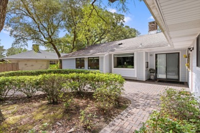 Nestled on a spacious 1/3-acre corner lot backing to a peaceful on Golf Club at Bluewater Bay Resort in Florida - for sale on GolfHomes.com, golf home, golf lot
