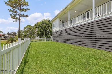 Welcome to 129 Sweet Bay Dr., a stunning coastal retreat nestled on Pass Christian Isles Golf Club in Mississippi - for sale on GolfHomes.com, golf home, golf lot