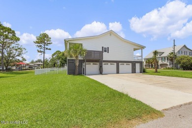 Welcome to 129 Sweet Bay Dr., a stunning coastal retreat nestled on Pass Christian Isles Golf Club in Mississippi - for sale on GolfHomes.com, golf home, golf lot