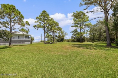 Welcome to 129 Sweet Bay Dr., a stunning coastal retreat nestled on Pass Christian Isles Golf Club in Mississippi - for sale on GolfHomes.com, golf home, golf lot