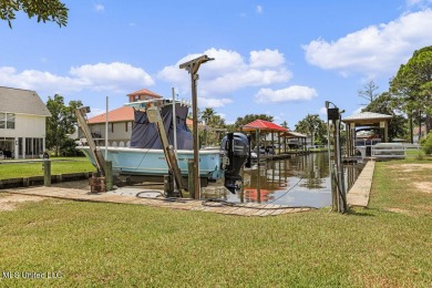 Welcome to 129 Sweet Bay Dr., a stunning coastal retreat nestled on Pass Christian Isles Golf Club in Mississippi - for sale on GolfHomes.com, golf home, golf lot